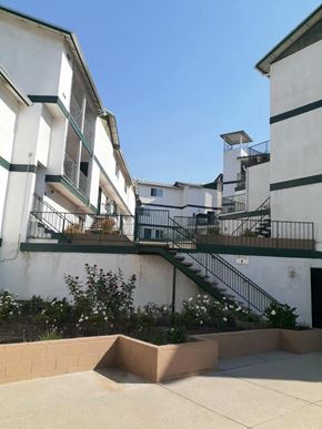 Los Angeles apartment for rent - an apartment building with stairs and balconies and a blue sky