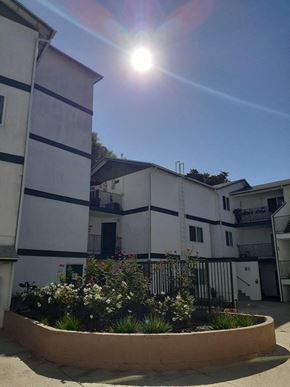 Los Angeles apartment for rent - the sun is shining in the sky over an apartment building