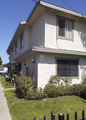 Los Angeles apartment for rent - A two-story house with a white facade and a small front yard.