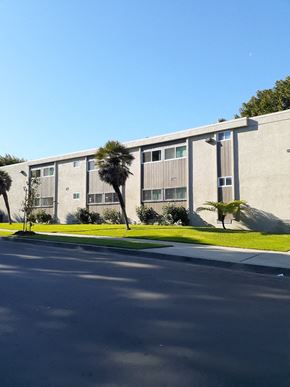 Los Angeles apartment for rent - a building with palm trees in front of it