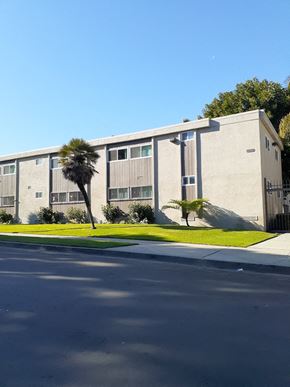 Los Angeles apartment for rent - a building with palm trees in front of it
