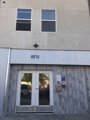 Panorama City apartment for rent - A building with the number 8715 on the corner.
