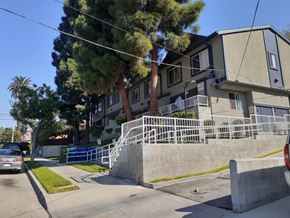 Los Angeles apartment for rent - A residential building with a tree in front of it.