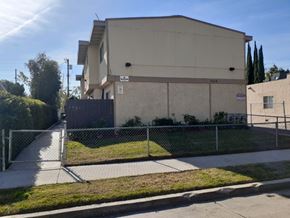 North Hollywood apartment for rent - A building with a fence in front of it.