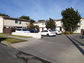 North Hollywood apartment for rent - A white car is parked in front of a house.