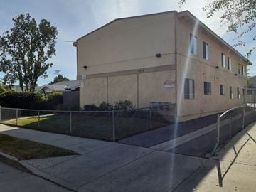 North Hollywood apartment for rent - A building with a fence in front of it.