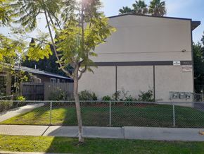 North Hollywood apartment for rent - A building with a tree in front of it.
