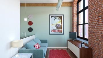 Providence apartment for rent - A living room with a grey couch and a red carpet.