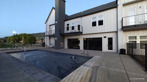 Medford apartment for rent - a new house with a swimming pool in front of it