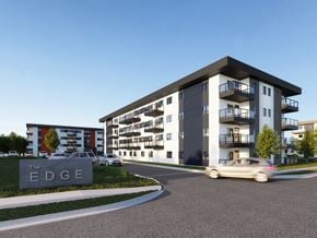 Brandon apartment for rent - a rendering of an apartment building with cars driving by