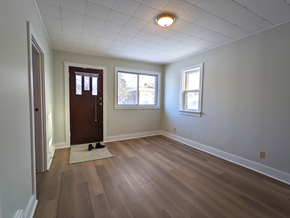 Brandon apartment for rent - an empty living room with wooden floors and white walls