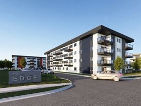Brandon apartment for rent - a rendering of an apartment building with cars driving by