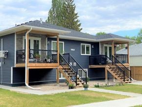 Brandon apartment for rent - a blue house with a deck and a porch