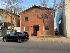 Brandon apartment for rent - a black car parked in front of a brick building
