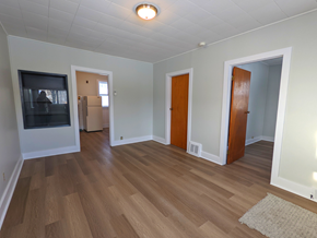 Brandon apartment for rent - a living room with wood flooring and a fireplace