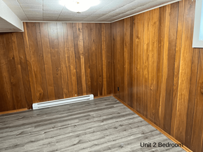 Brandon apartment for rent - an empty room with wooden walls and a wood floor