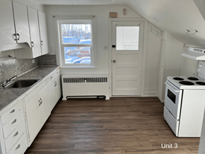 Brandon apartment for rent - an empty kitchen with white appliances and white cabinets