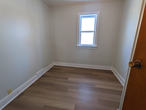 Brandon apartment for rent - a empty room with wooden floors and a window