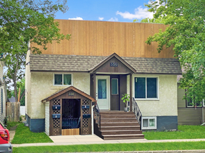 Brandon apartment for rent - a tan house with a brown roof and stairs