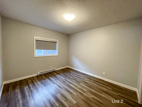 Brandon apartment for rent - the bedroom with hardwood flooring and a window