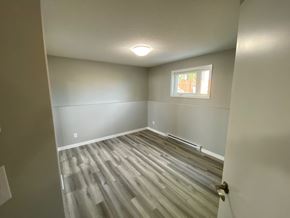 Brandon apartment for rent - a empty room with vinyl flooring and a window