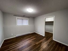 Brandon apartment for rent - the interior of a bedroom with wood flooring and a closet