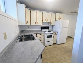 Brandon apartment for rent - an empty kitchen with white appliances and white cabinets