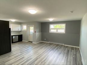 Brandon apartment for rent - an empty living room and kitchen in a new home