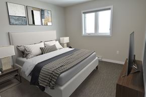 Portage La Prairie apartment for rent - a bedroom with a bed and a window