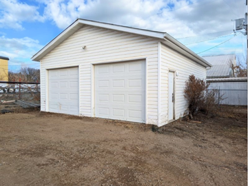 Brandon apartment for rent - a small white garage with a white garage door