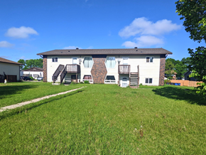 Brandon apartment for rent - a large white house with a yard in front of it