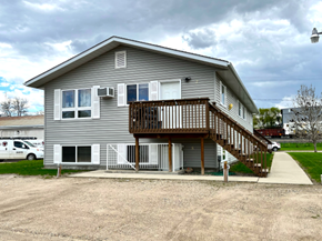 Brandon apartment for rent - the front of a house with a deck and a driveway