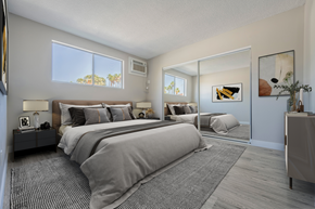 Palm Springs apartment for rent - a bedroom with a large bed and a mirrored closet