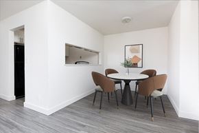 Watsonville apartment for rent - a dining room with a table and chairs and a mirror