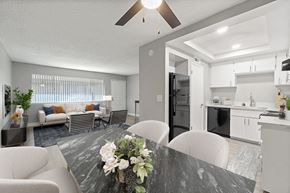 Clovis apartment for rent - A modern kitchen with a dining table set in the middle.