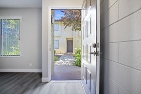 Madera apartment for rent - an open door leading to a courtyard with a building in the background