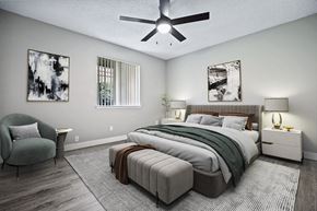 Clovis apartment for rent - a bedroom with a large bed and a ceiling fan