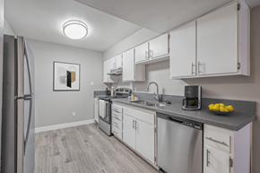 Indio apartment for rent - A kitchen with a refrigerator, stove, and microwave.