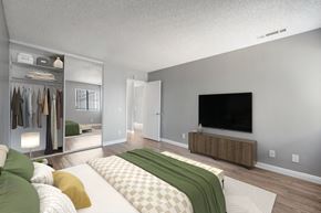 Palmdale apartment for rent - a bedroom with a large bed and a tv