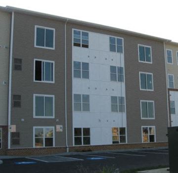 Hagerstown apartment for rent - Apartment building with grey and white exterior.