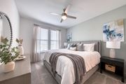 Palm Bay apartment for rent - a bedroom with a large bed and a ceiling fan