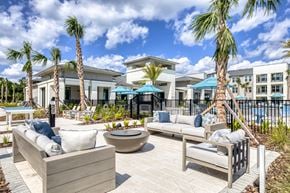 Jacksonville apartment for rent - Poolside patio and lounge area.
