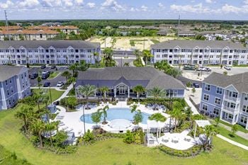 Resort style pool with tanning ledge, sundeck & cabanas
