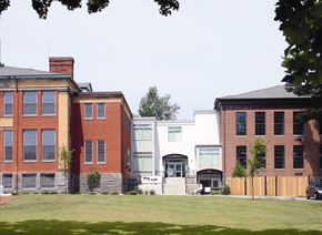 Ware apartment for rent - a group of buildings on the side of a lawn