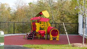 Ludlow apartment for rent - A playground with a red and yellow slide.