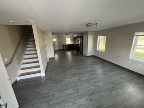 Ludlow apartment for rent - A spacious room with a staircase and a dining area.