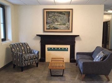 Northampton apartment for rent - a living room with two chairs and a fireplace