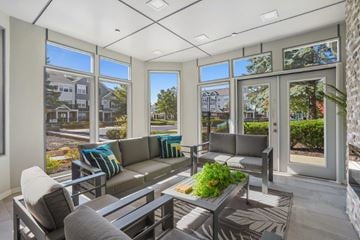 West Dundee apartment for rent - A sunny day in a modern living room with a grey sofa and a coffee table.
