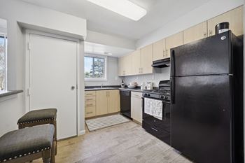 Kitchen with black applianes