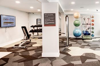 A view of the fitness center with weights and other exercise equipment
